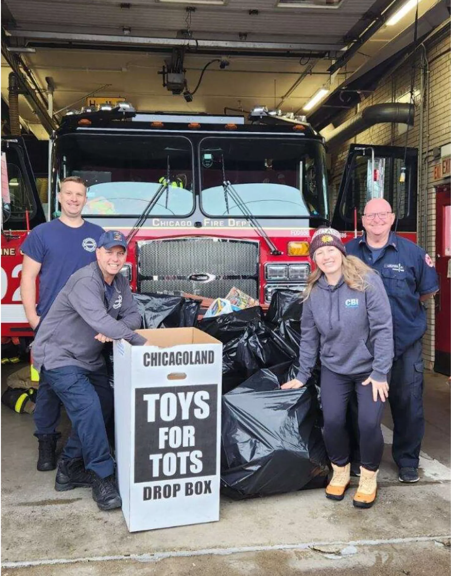 BSI and CBI Staff in front of Mt. Greenwood Fire House with donated toys